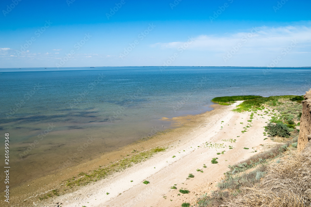 Landscape sea ocean blue sky sand beach on a sunny day. summer vacation concept Landscape sea ocean blue sky sand beach on a sunny day. summer vacation concept