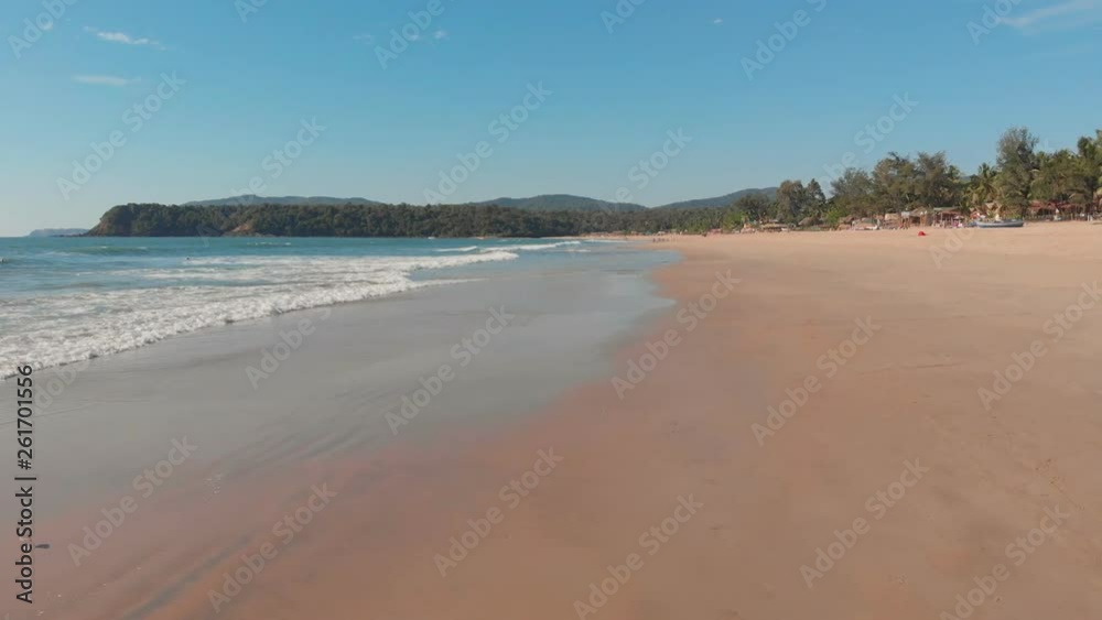 Low drone flight over the waves of Agonda beach. Goa State. India. Low drone flight over the waves of Agonda beach. Goa State. India.
