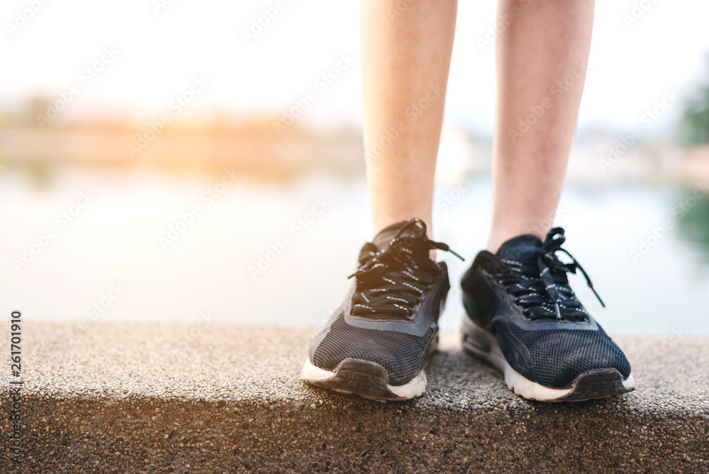 Women running on the park with Close up shoes	