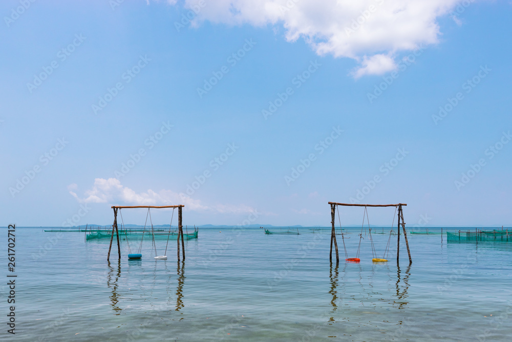 The unusual swings on the sea beach The unusual swings on the sea beach
