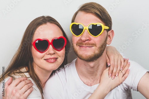 couple in heart-shaped sunglasses