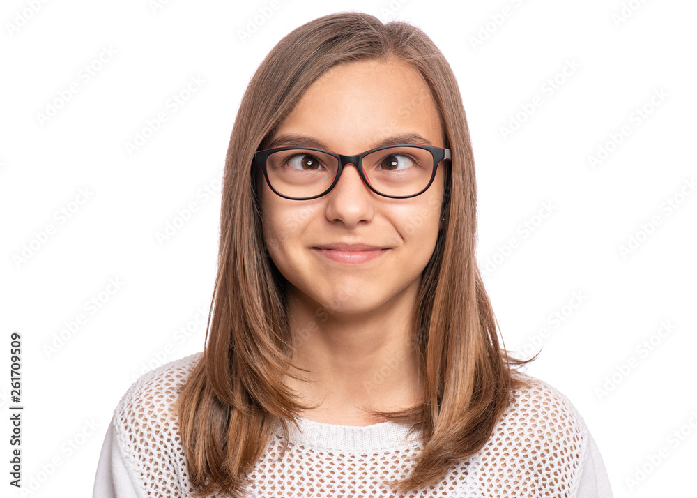 Obraz premium Crazy child making grimace - Silly face. Funny caucasian teen girl in eyeglasses, isolated on white background. Close-up portrait.