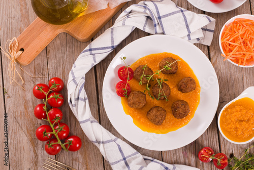 Meatballs with mashed carrots.