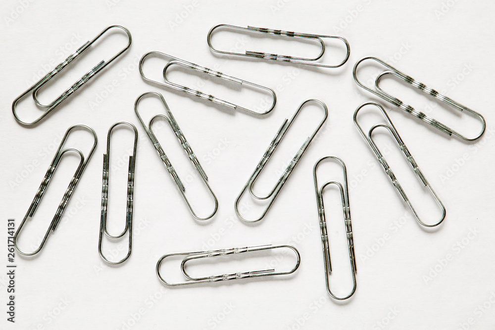 silver paper clips on white background silver paper clips on white background