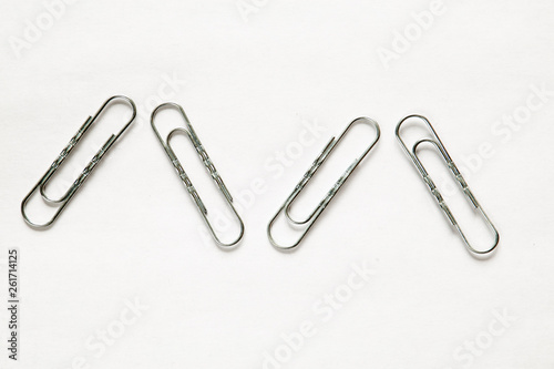 silver paper clips on white background