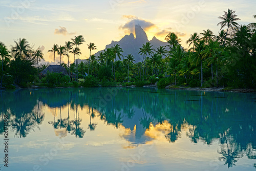 View of the Mont Otemanu mountain reflecting in water at sunset in Bora Bora, French Polynesia, South Pacific photo