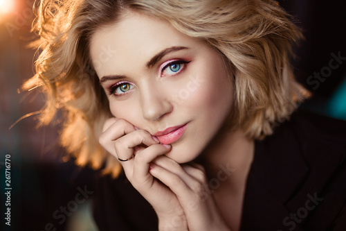 Blonde girl with curly hair/advertising