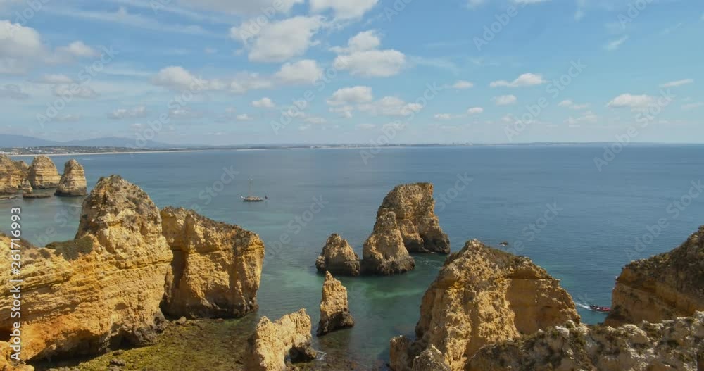 Cloud seascape timelapse, of Ponta da Piedade (cliff formations along coastline of Lagos city), famous natural landmark destination, Algarve. Portugal. Cloud seascape timelapse, of Ponta da Piedade (cliff formations along coastline of Lagos city), famous natural landmark destination, Algarve. Portugal.