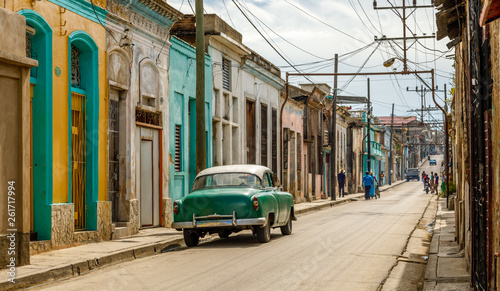 Old living houses across the road in the center of Santiago De Cuba, Cuba