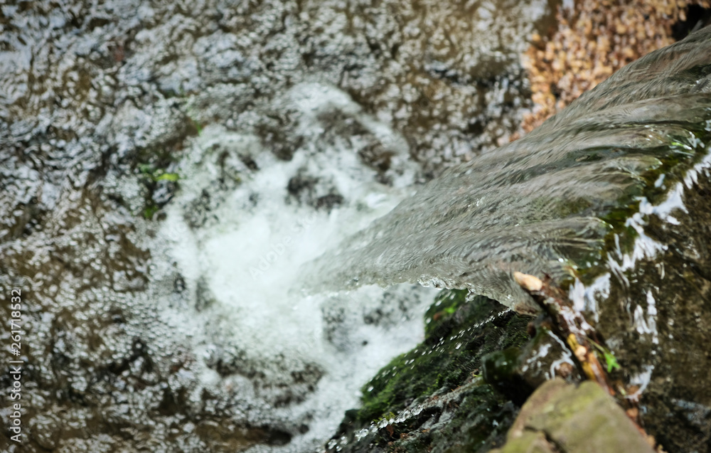 pond with small clear waterfall in forest pond with small clear waterfall in forest