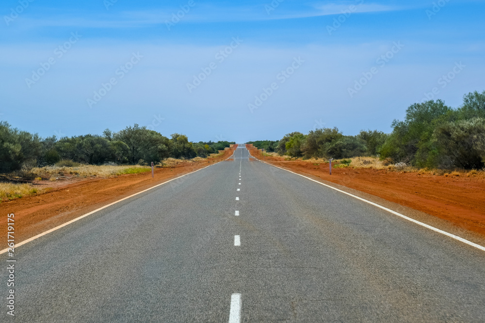 Straight and endless empty road in Western Australian Outback