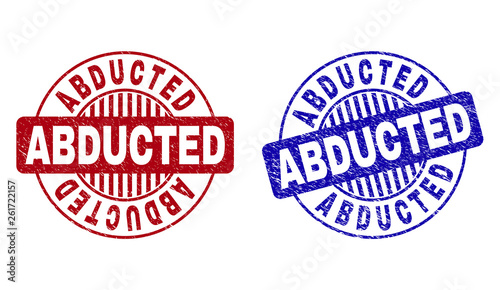Grunge ABDUCTED round stamp seals isolated on a white background. Round seals with distress texture in red and blue colors. Vector rubber watermark of ABDUCTED text inside circle form with stripes.
