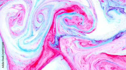 Abstract multicolored background. Screen saver. Fluid art with pink blue color. Blue pink texture. Colored paint stains in liquid