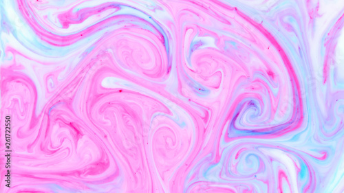 Abstract multicolored background. Screen saver. Fluid art with pink blue color. Blue pink texture. Colored paint stains in liquid