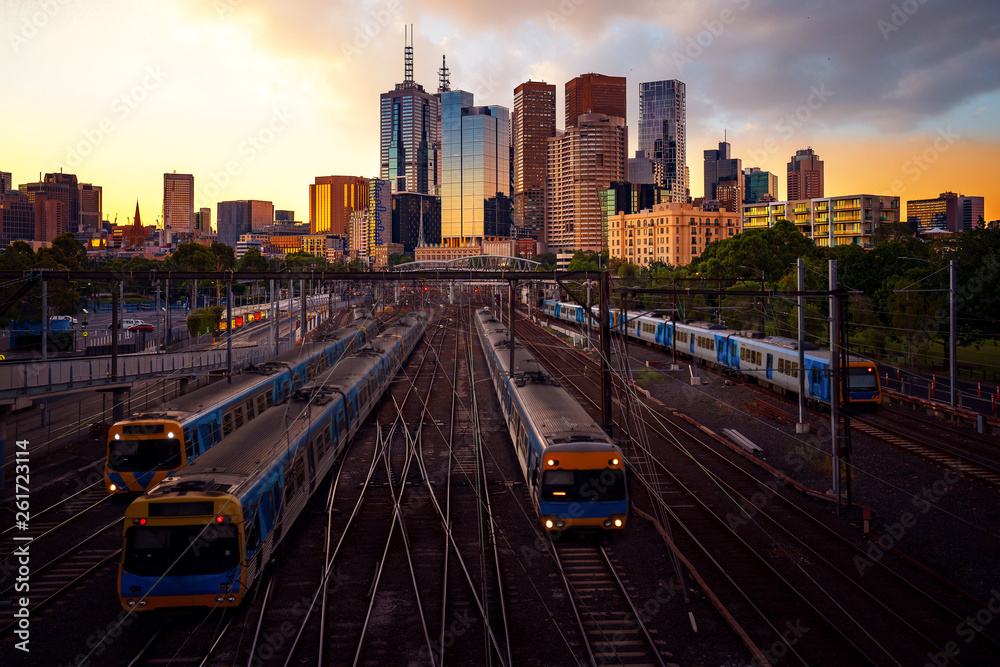 Naklejka premium Melbourne train staation with Melbourne city background