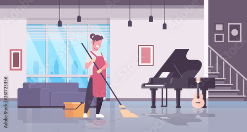 woman in gloves and apron washing floor girl using mop housewife doing housework cleaning concept modern living room interior flat horizontal full length