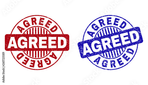Grunge AGREED round stamp seals isolated on a white background. Round seals with distress texture in red and blue colors. Vector rubber imprint of AGREED caption inside circle form with stripes.
