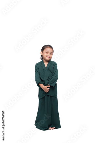 Malay girl posing with baju kurung, a traditional dress