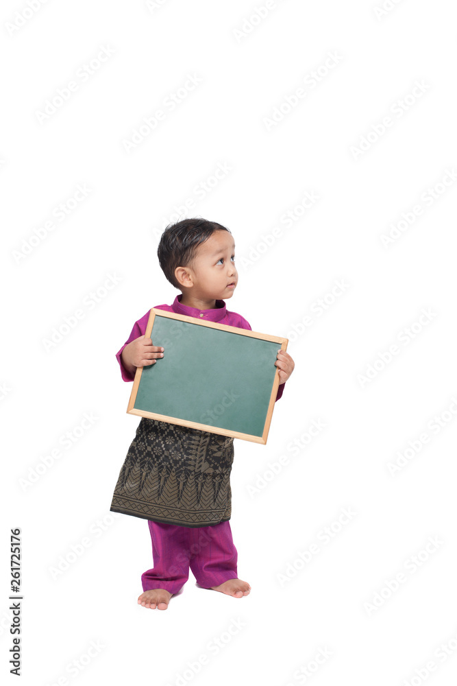 Boy holding a blank black board wearing traditional costume Boy holding a blank black board wearing traditional costume