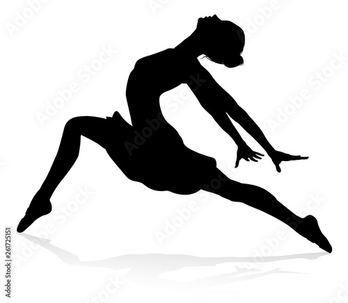 Ballet dancer woman in silhouette dancing in posed position