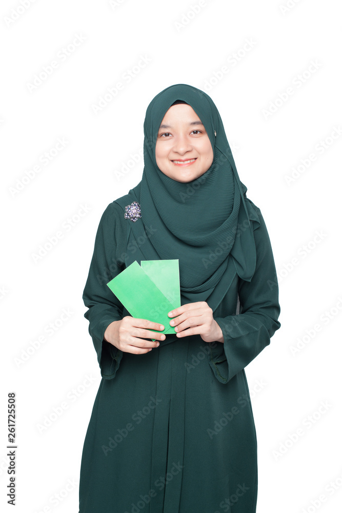 Malay woman holding green money packet. Malay woman holding green money packet.
