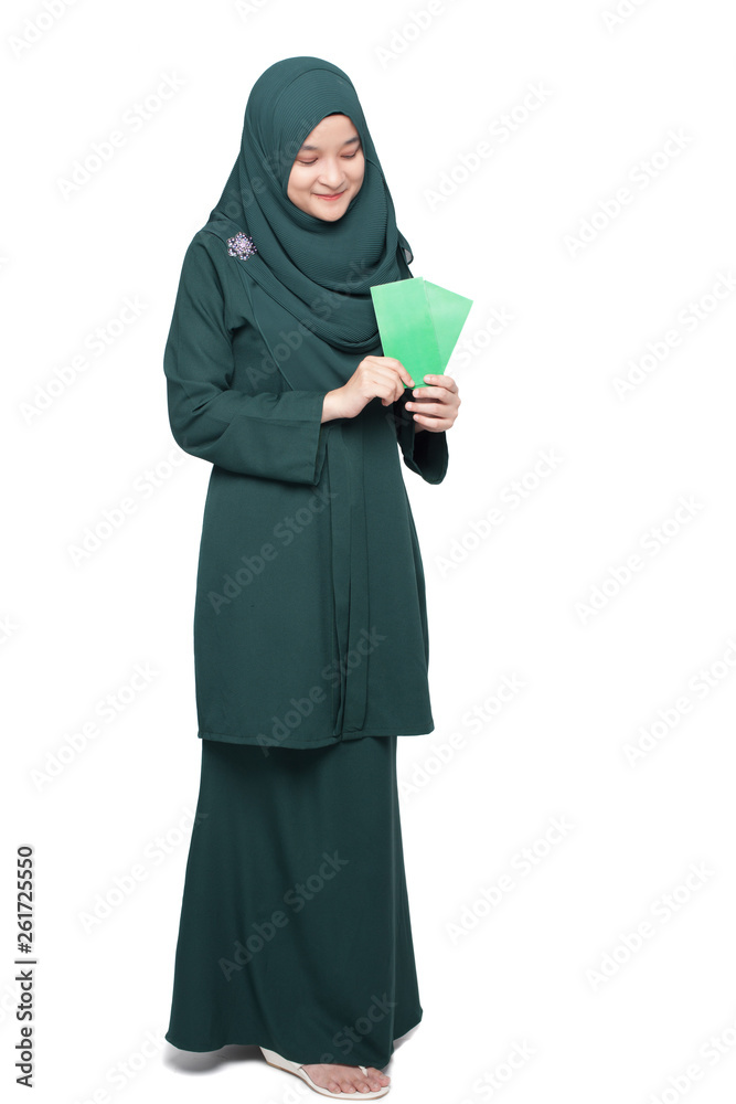 Malay woman holding green money packet. Malay woman holding green money packet.
