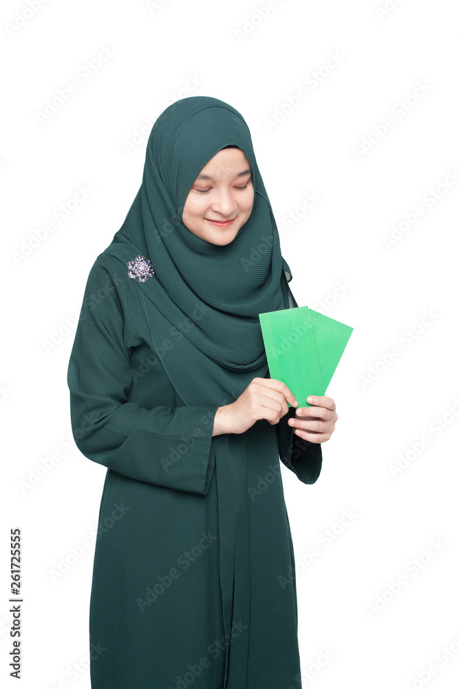 Malay woman holding green money packet. Malay woman holding green money packet.