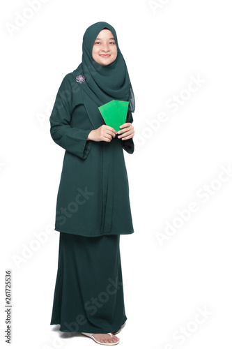 Malay woman holding green money packet.