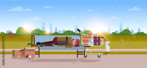 poor man sleeping outdoor drunk beggar lying on wooden bench homeless concept city park landscape sunrise background horizontal full length