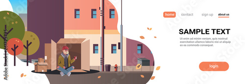 poor man sitting cardboard box guy begging for help beggar holding paper cup homeless concept city street buildings cityscape background horizontal full length copy space