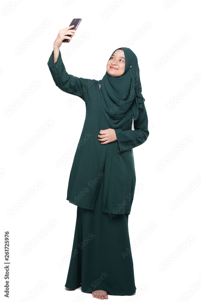 Malay woman taking selfie using smartphone