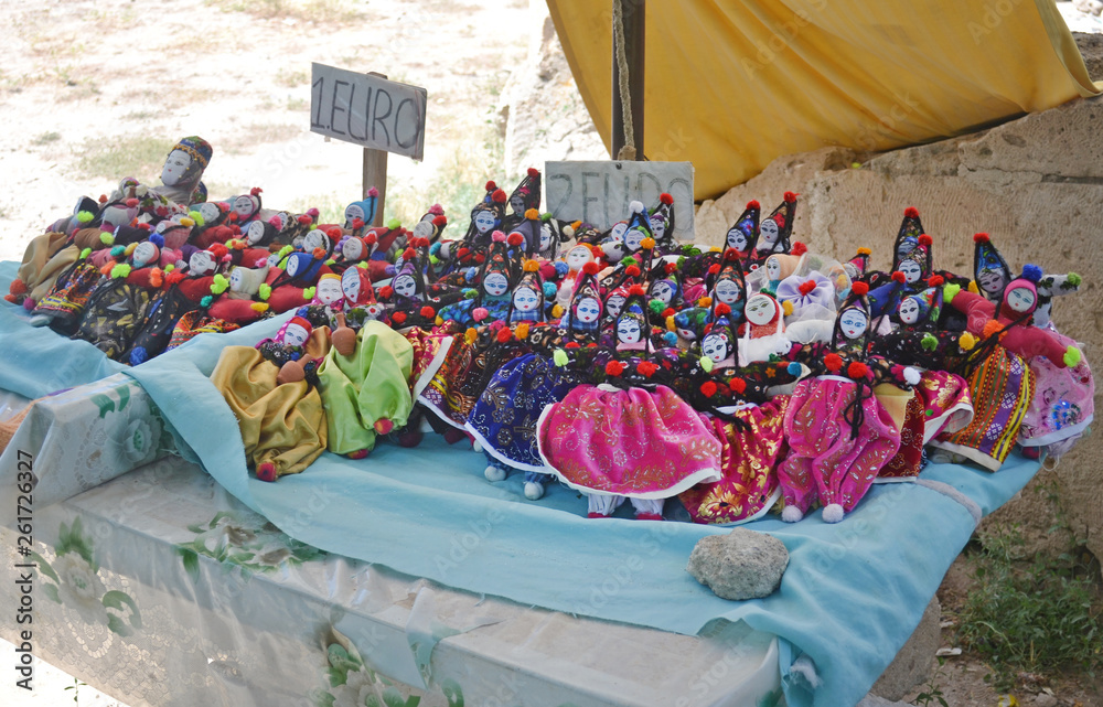 Muslim souvenir rag dolls tray in the bazaar. Sale for tourists, Turkey