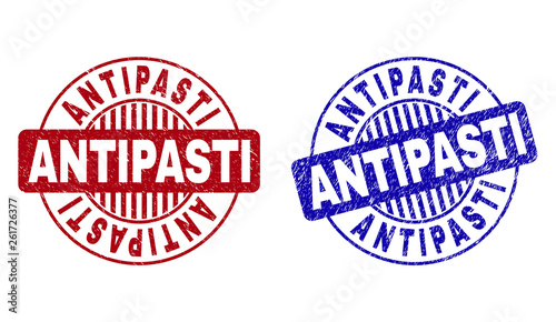 Grunge ANTIPASTI round stamp seals isolated on a white background. Round seals with grunge texture in red and blue colors. Vector rubber imitation of ANTIPASTI title inside circle form with stripes.