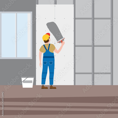 Workers put plaster, installing gypsum plasterboard panels in the interior