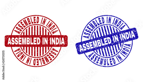 Grunge ASSEMBLED IN INDIA round stamp seals isolated on a white background. Round seals with grunge texture in red and blue colors.