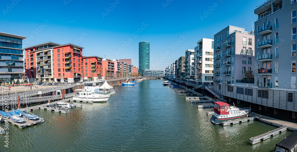 Frankfurt Westhafen with modern architecture, small harbor and residential buildings