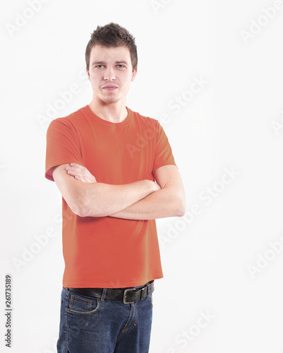 confident young man in an orange shirt. photo