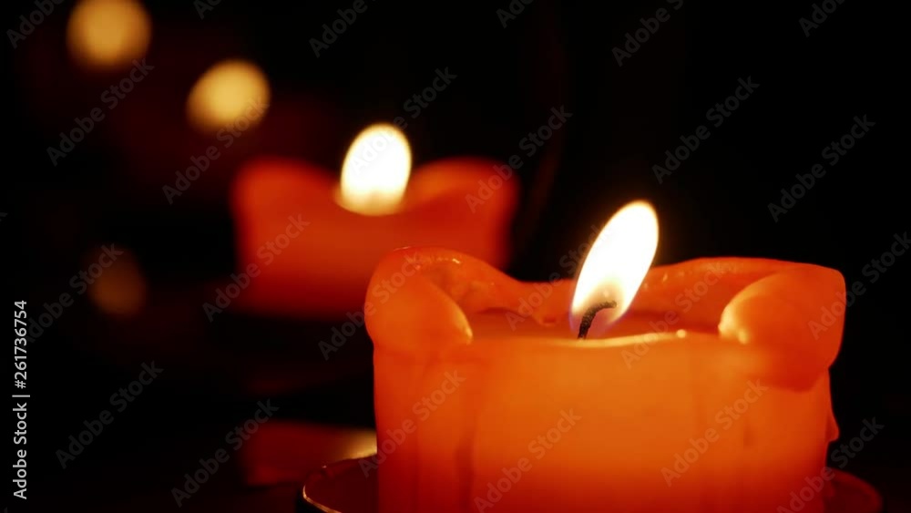 Candle in dark with reflections short infinite loop