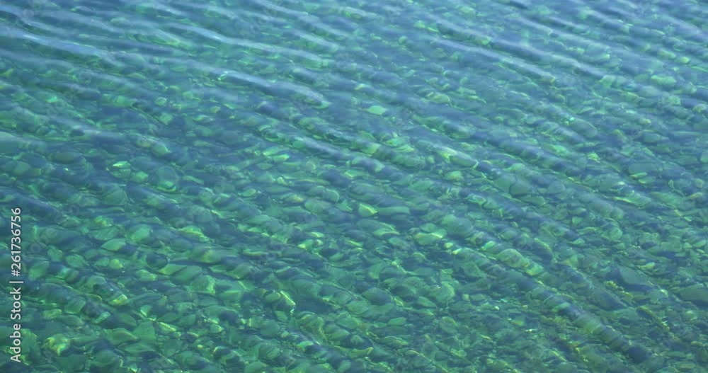 Clean transparent elegant emerald water wave of Baikal lake in Olkhon island, Irkutsk Russia Clean transparent elegant emerald water wave of Baikal lake in Olkhon island, Irkutsk Russia