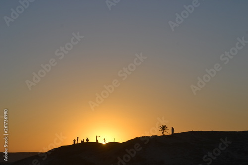 Silhouettes on a hill