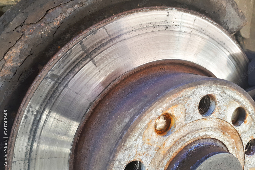 Closeup disc brake of the vehicle for repair. Detail image of car brakes.