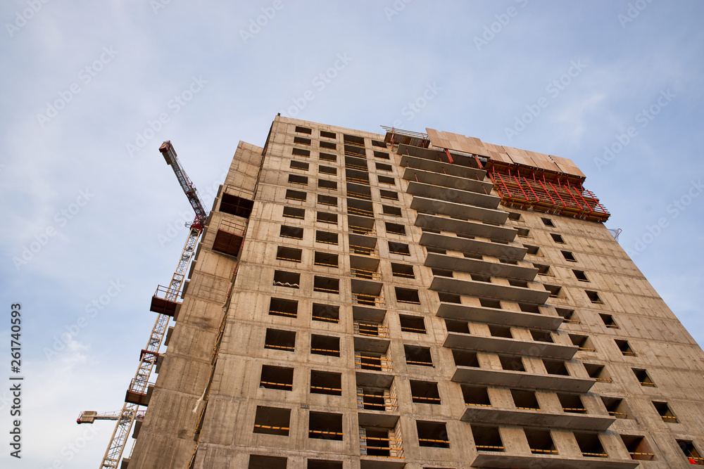 Construction of residential buildings of new neighborhoods. the process of building a multi-storey residential building Construction of residential buildings of new neighborhoods. the process of building a multi-storey residential building