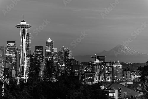 Black and white image of the skyline of the city of Seattle and the profile of Mount Rainier in the background.