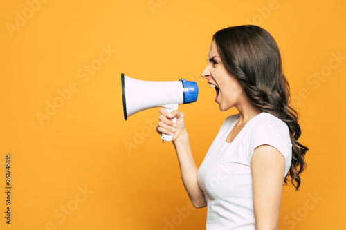 Going on rant. Vibrant orange background with an angry girl next to it who is loudly screaming and using a megaphone for it.
