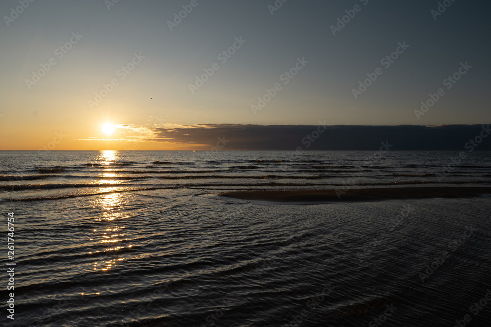 Vivid sunset with very low sun on the Baltic Sea - Red colors - Tuja, Latvia - April 13, 2019