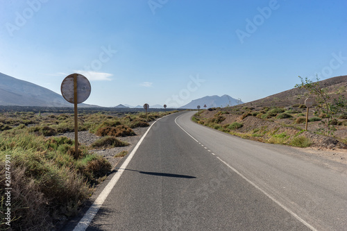 Endless road in the desert of Fuerteventura at Canary Islands of Spain