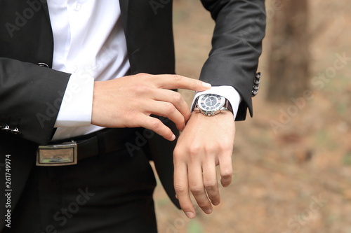close up. businessman looking at his watch.concept of time.