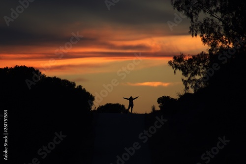 Happy woman silhouette at sunset © Rui_Bento87