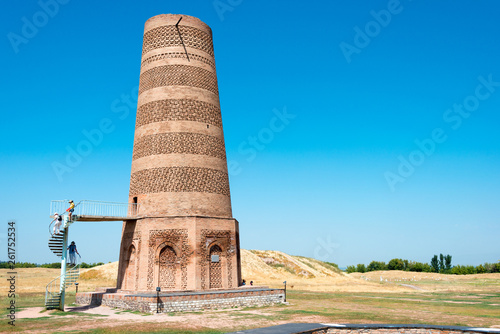 Tokmok, Kyrgyzstan - Aug 08 2018: Ruins of Burana Tower in Tokmok, Kyrgyzstan. It is part of the World Heritage Site - Silk Roads: the Routes Network of Chang'an-Tianshan Corridor. photo