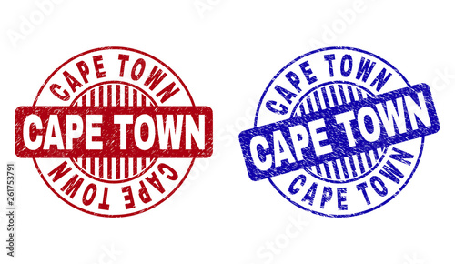 Grunge CAPE TOWN round watermarks isolated on a white background. Round seals with grunge texture in red and blue colors. Vector rubber watermark of CAPE TOWN caption inside circle form with stripes.